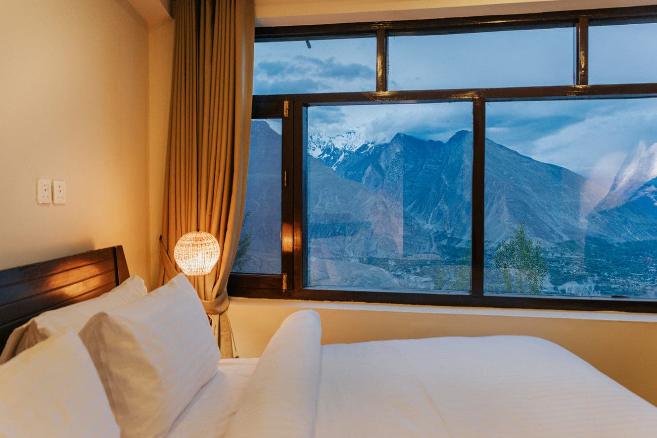 Bedroom with mountain-facing window at Offsite.Living
